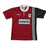 camisa-adidas-oasis-vermelha-preta-Bolt-Makers-Arms-2025-26-masculina